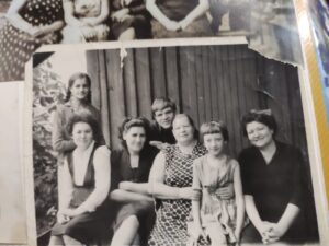 Первая справа